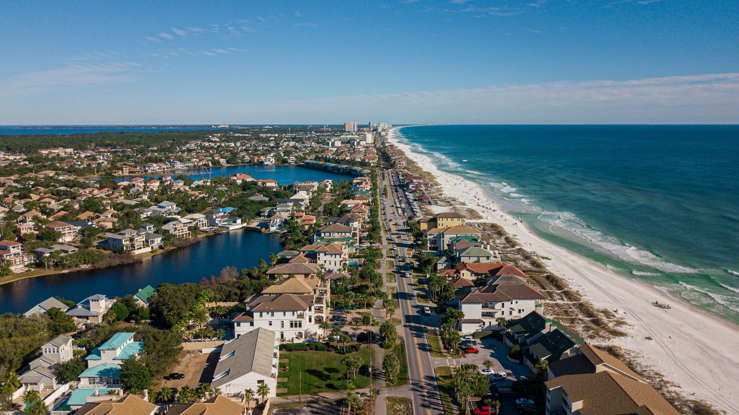 Aerial view of Destin: coastal homes and lakes beside the Gulf beach